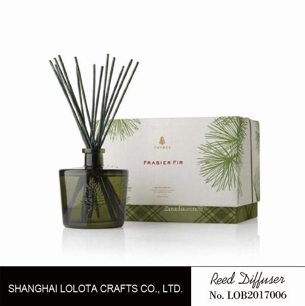 Blackish green color bottle with natural stick and rigid gift box
