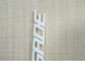 Quality White / Ivory Automotive Plastic Injection Molding Custom Vehicle Logos Sub Gate Type for sale