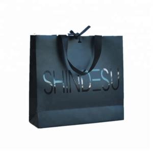 Quality Customized Logo Printed Paper Merchandise Bags Luxury High Bearing Capacity for sale