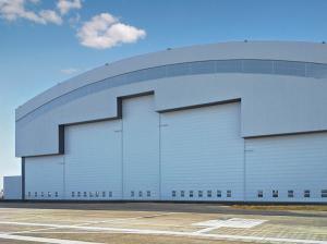 Quality Prefab Curve Roofing System Steel Aircraft Hangars With Electrical Slide Doors for sale