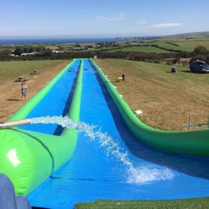 China 100m Giant Inflatable Slip N Slide With Pool For Kids And Adults on sale